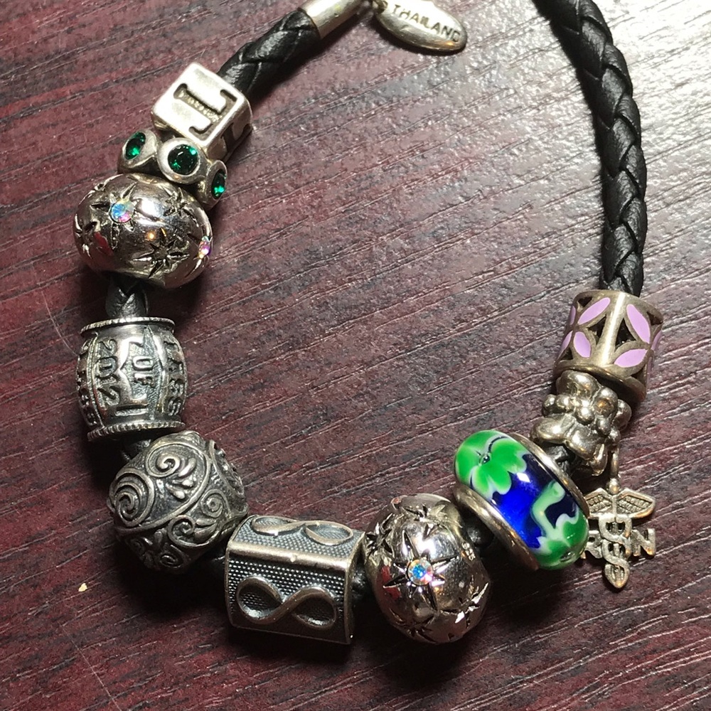 Leather and sterling charm bracelet.